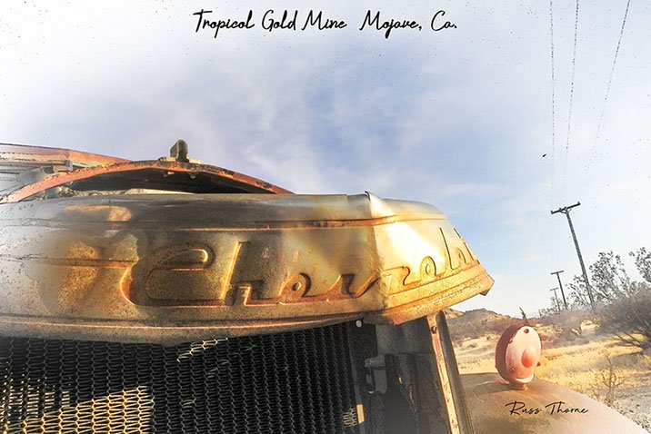 An early 1940s Chevrolet pickup, weathered and beaten, showing significant signs of damage and likely beyond repair.