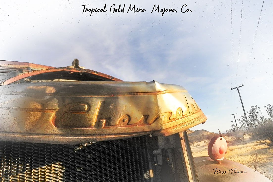 An early 1940s Chevrolet pickup, weathered and beaten, showing significant signs of damage and likely beyond repair.